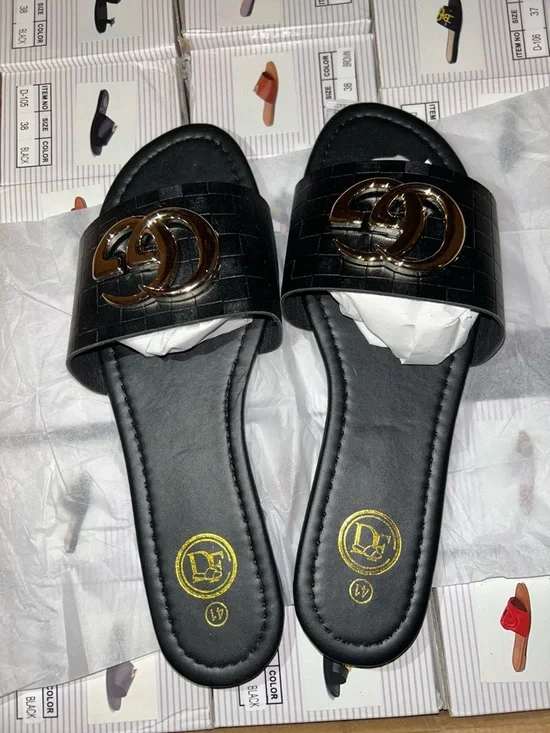 Women’s Black Slide Sandals with Gold Double-Emblem Accent - Picture 1 of 2